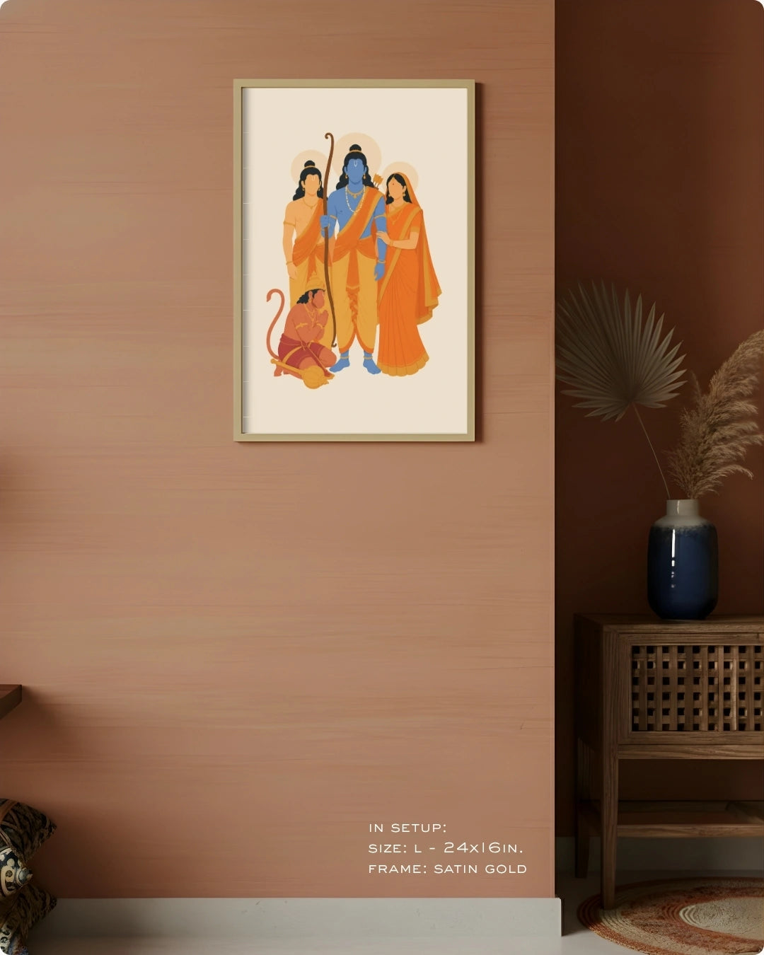 Visual size guide mockup for the Ram Darbar wall art in Large size with a satin gold frame, displayed against a warm terracotta accent wall.