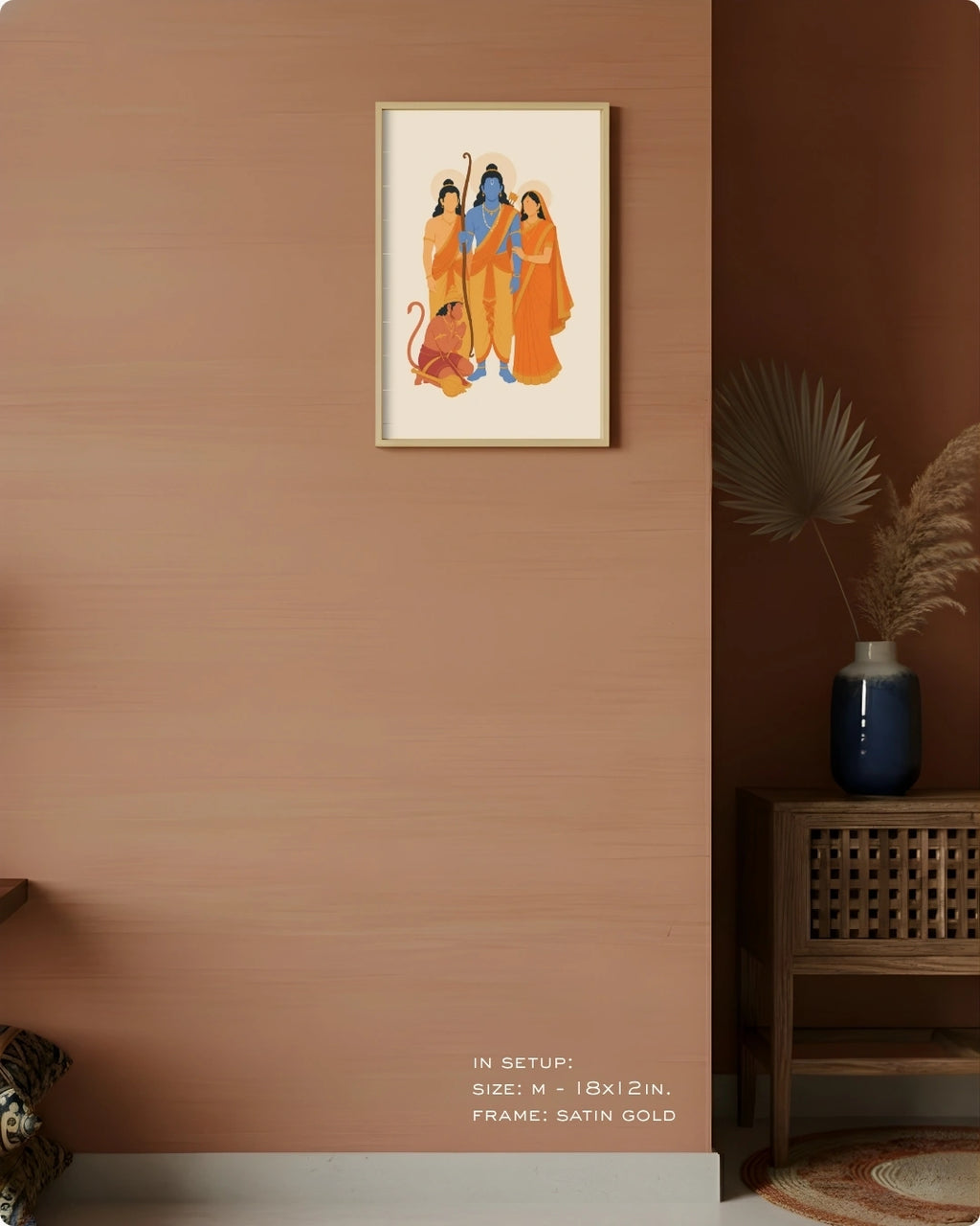 Visual size guide mockup for the Ram Darbar wall art in Medium size with a satin gold frame, displayed against a warm terracotta accent wall.