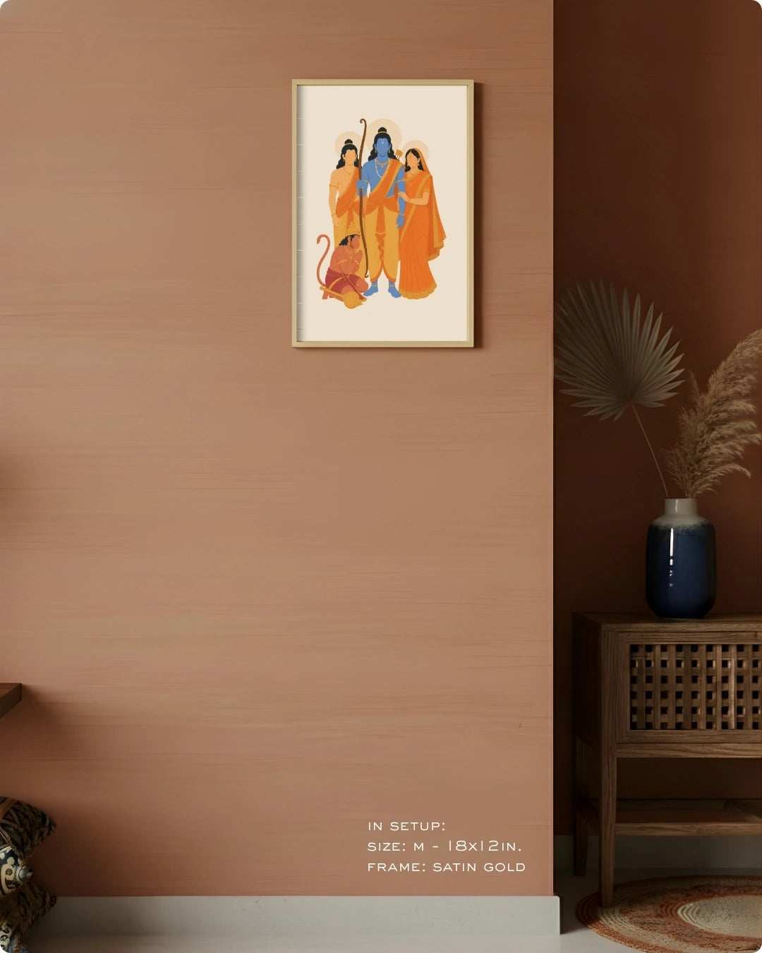 Visual size guide mockup for the Ram Darbar wall art in Medium size with a satin gold frame, displayed against a warm terracotta accent wall.