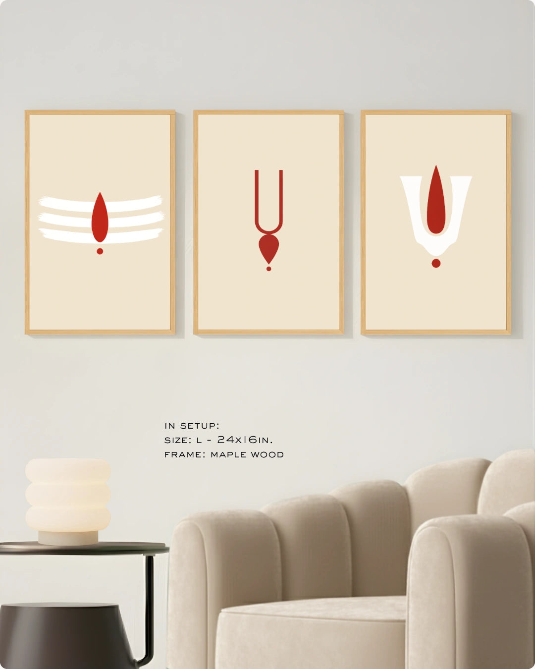 Visual size guide mockup for the sacred tilak modern Hindu wall art triptych in Large size with maple frames displayed over a minimalist beige ribbed sofa.