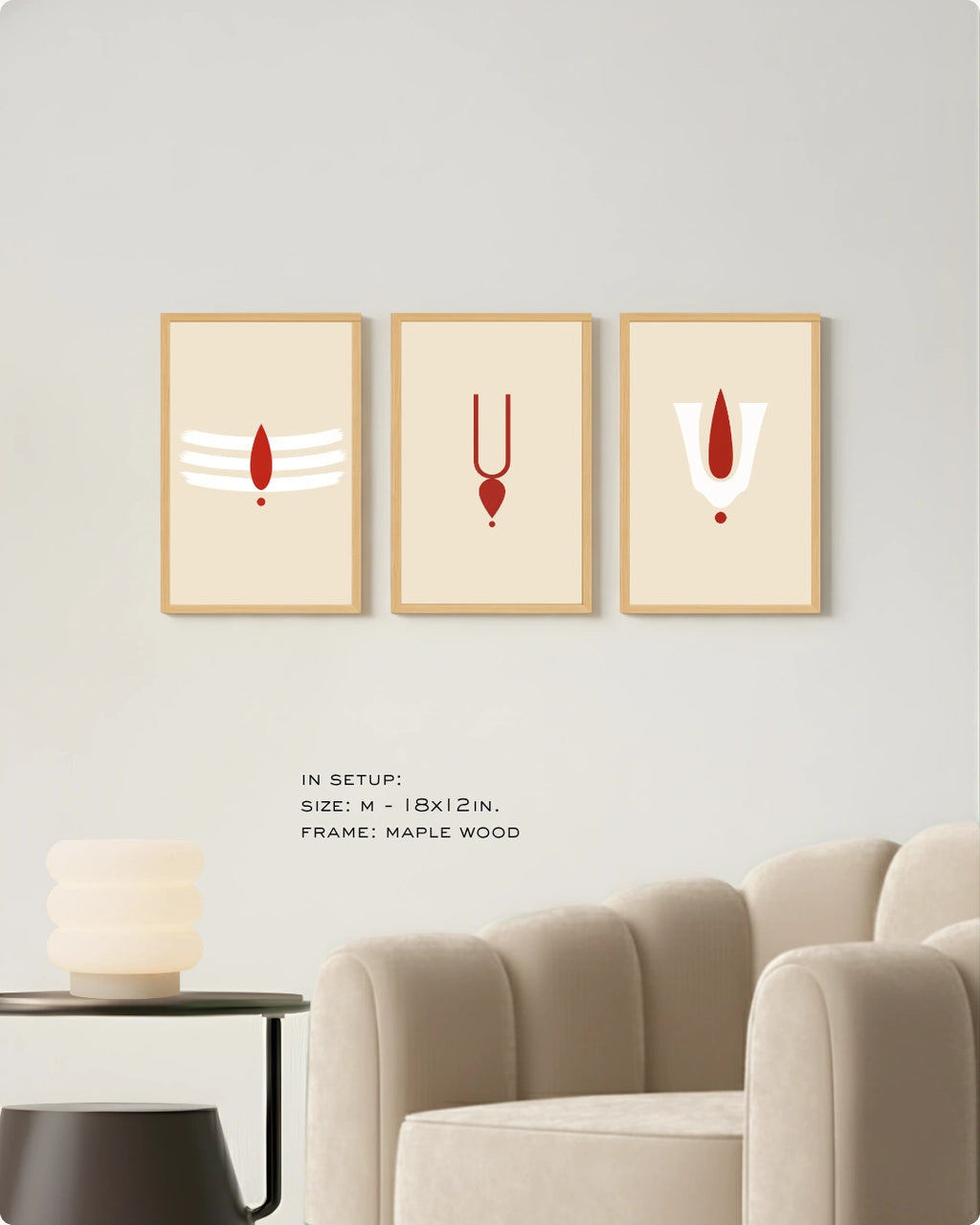 Visual size guide mockup for the sacred tilak modern Hindu wall art triptych in Medium size with maple frames displayed over a minimalist beige ribbed sofa.