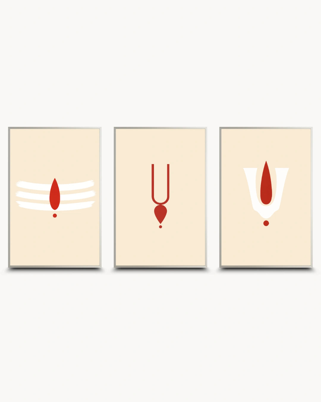 A set of three modern minimalist framed wall art prints on a light gray background. Each print has a cream background with a red and white spiritual symbol: a Shiva trident on the left, a Yantra symbol in the center, and a Gayatri symbol on the right.