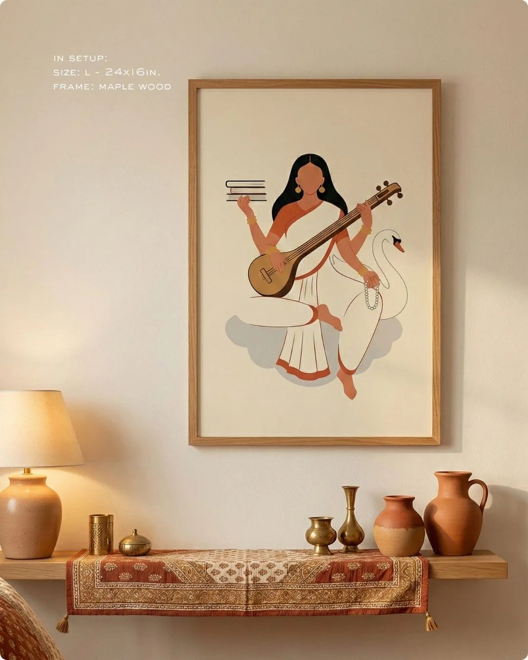 Minimalist Saraswati flat art in a Maple Wood frame, styled on a wooden floating shelf with a lamp and textured runner.