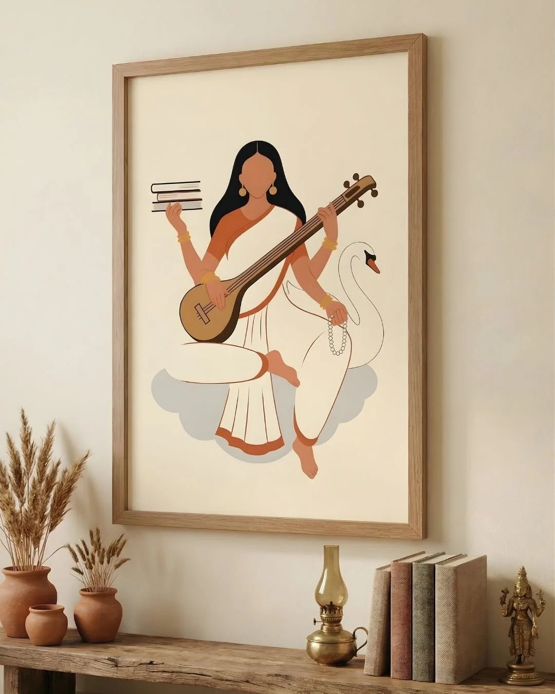 Goddess Saraswati minimalist print in a 0.5-inch Maple Wood frame, styled on a rustic bench with books and dried pampas grass.