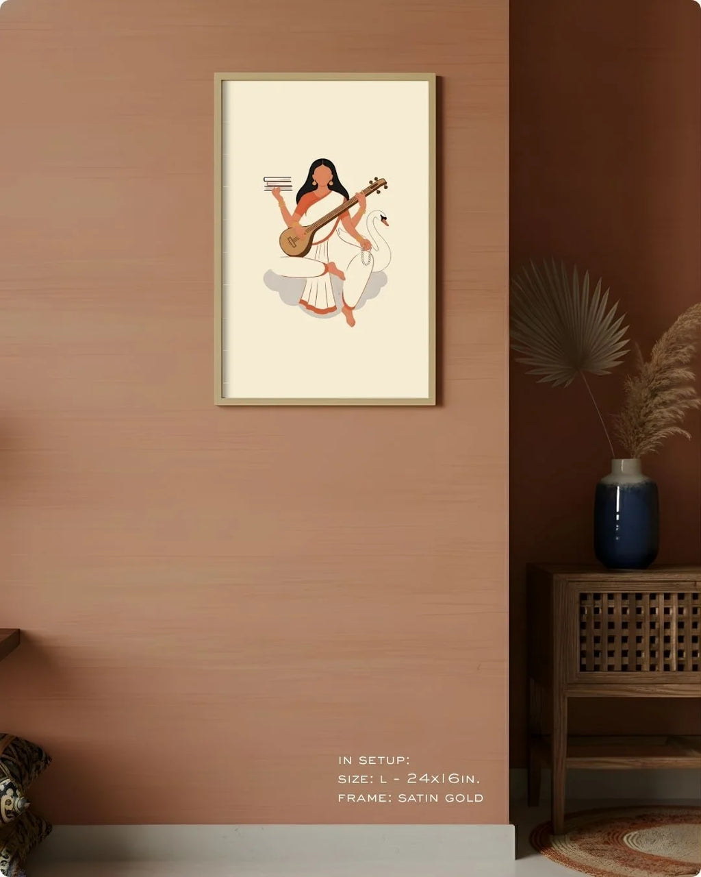 Medium (Size M - 18x12in) Goddess Saraswati minimalist art in a Satin Gold frame, showing scale on a warm earthy neutral wall.