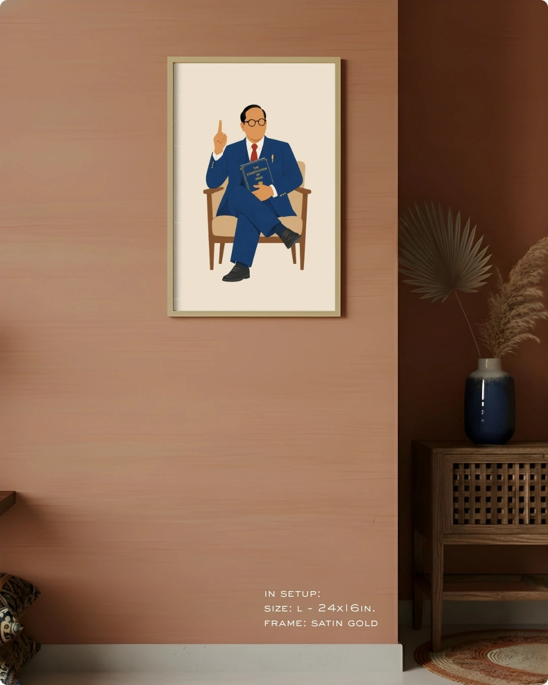 Visual size guide mockup for the seated Dr. B.R. Ambedkar wall art in Large size with a satin gold frame displayed against a warm terracotta accent wall.