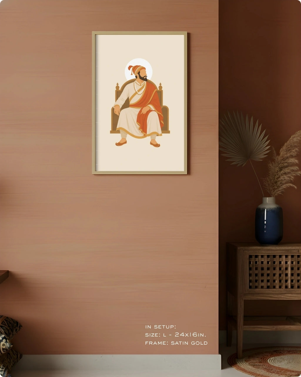 Visual size guide mockup for the seated Shivaji Maharaj wall art in Large size with a satin gold frame displayed against a warm terracotta accent wall.