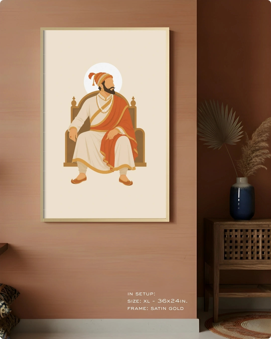 Visual size guide mockup for the seated Shivaji Maharaj wall art in Extra Large size with a satin gold frame displayed against a warm terracotta accent wall.