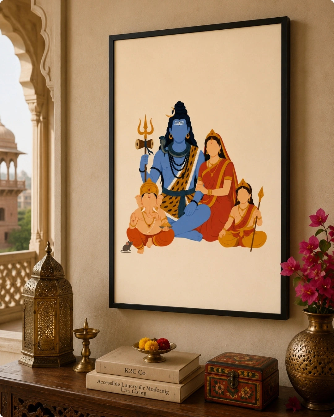 A framed art print featuring a stylized illustration of Hindu deities, including blue-skinned Lord Shiva and two children, displayed on a beige wall above a wooden console table with decorative items.