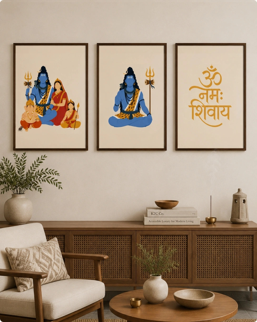 Lifestyle mockup of the Shiv Parivar Triad 3-piece wall art set in sleek black frames, styled beautifully above a cane media console in a warm, modern living room.