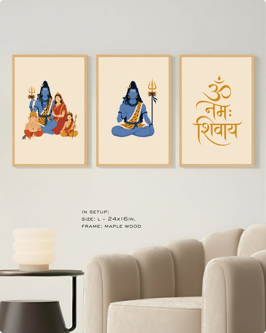 Visual size guide mockup for the Shiv Parivar Triad 3-piece wall art set in Large size with satin gold frames, displayed above a modern ribbed beige armchair.