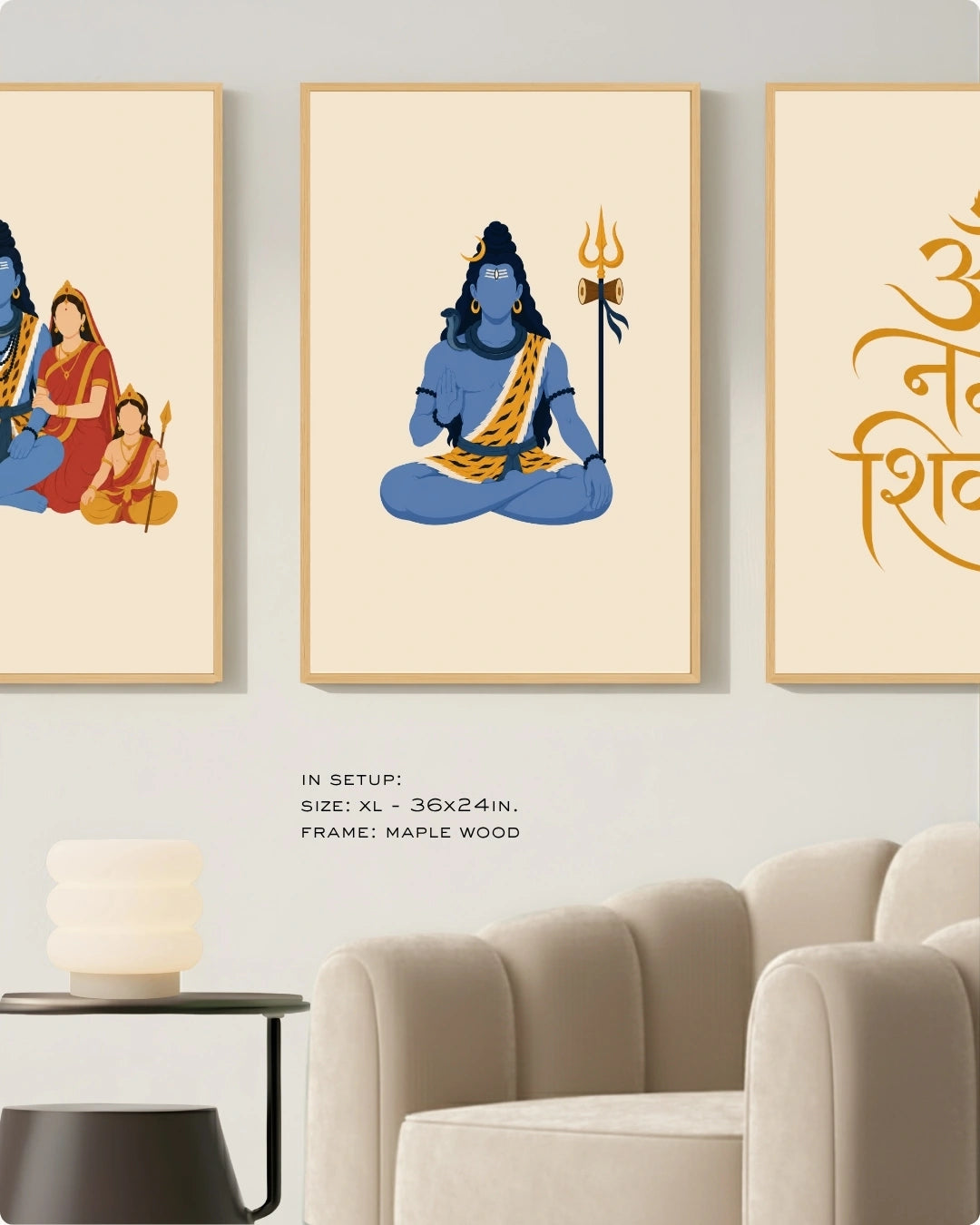 Visual size guide mockup for the Shiv Parivar Triad 3-piece wall art set in Extra Large size with satin gold frames, displayed above a modern ribbed beige armchair.