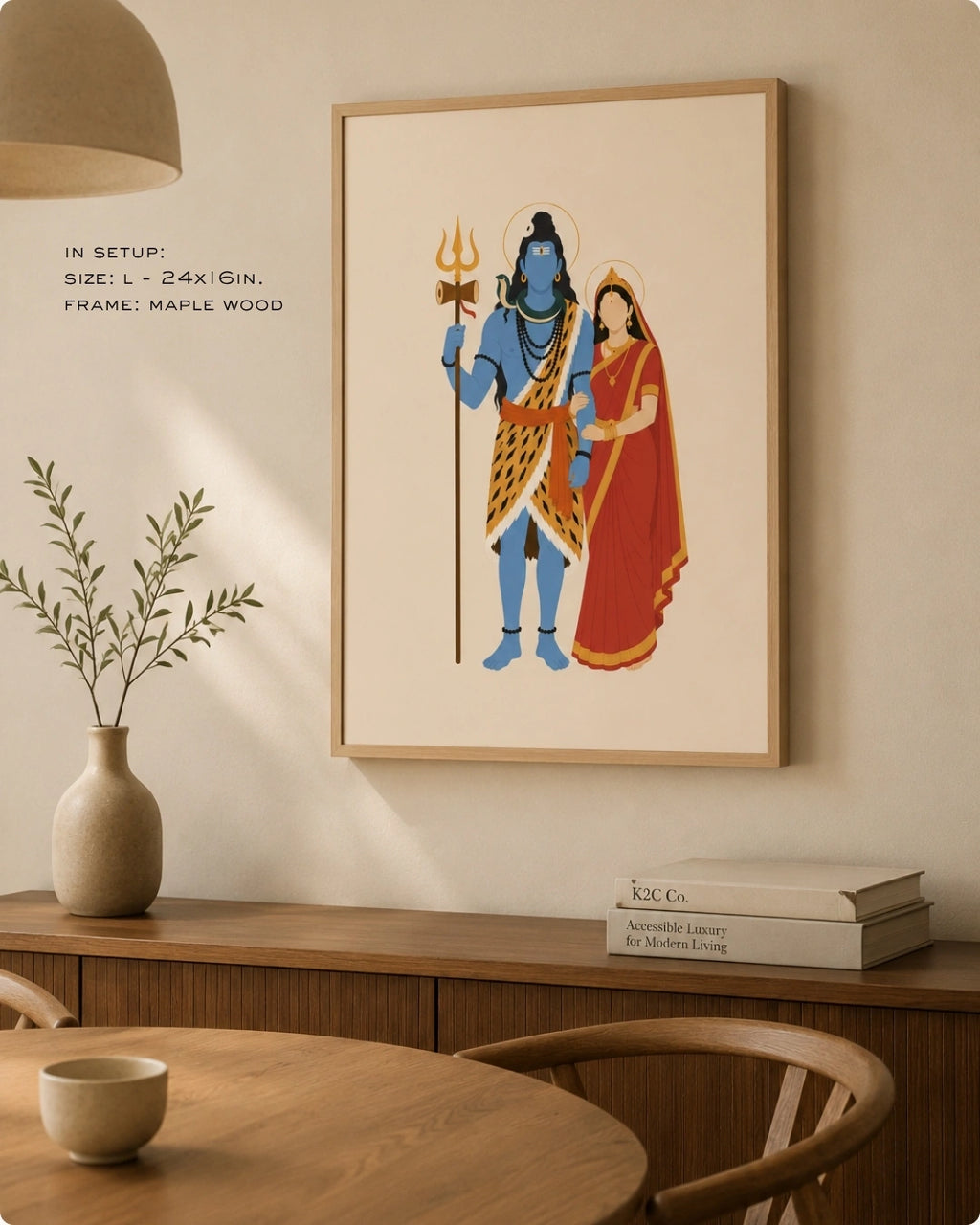 Lifestyle mockup of the minimalist Hindu divine couple Shiva and Parvati wall art in a maple wood frame, displayed in a warm, modern dining room setting.