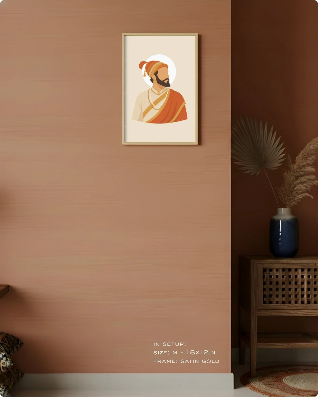 Visual size guide mockup for the Shivaji Maharaj wall art in Medium size with a satin gold frame displayed against a warm terracotta accent wall.