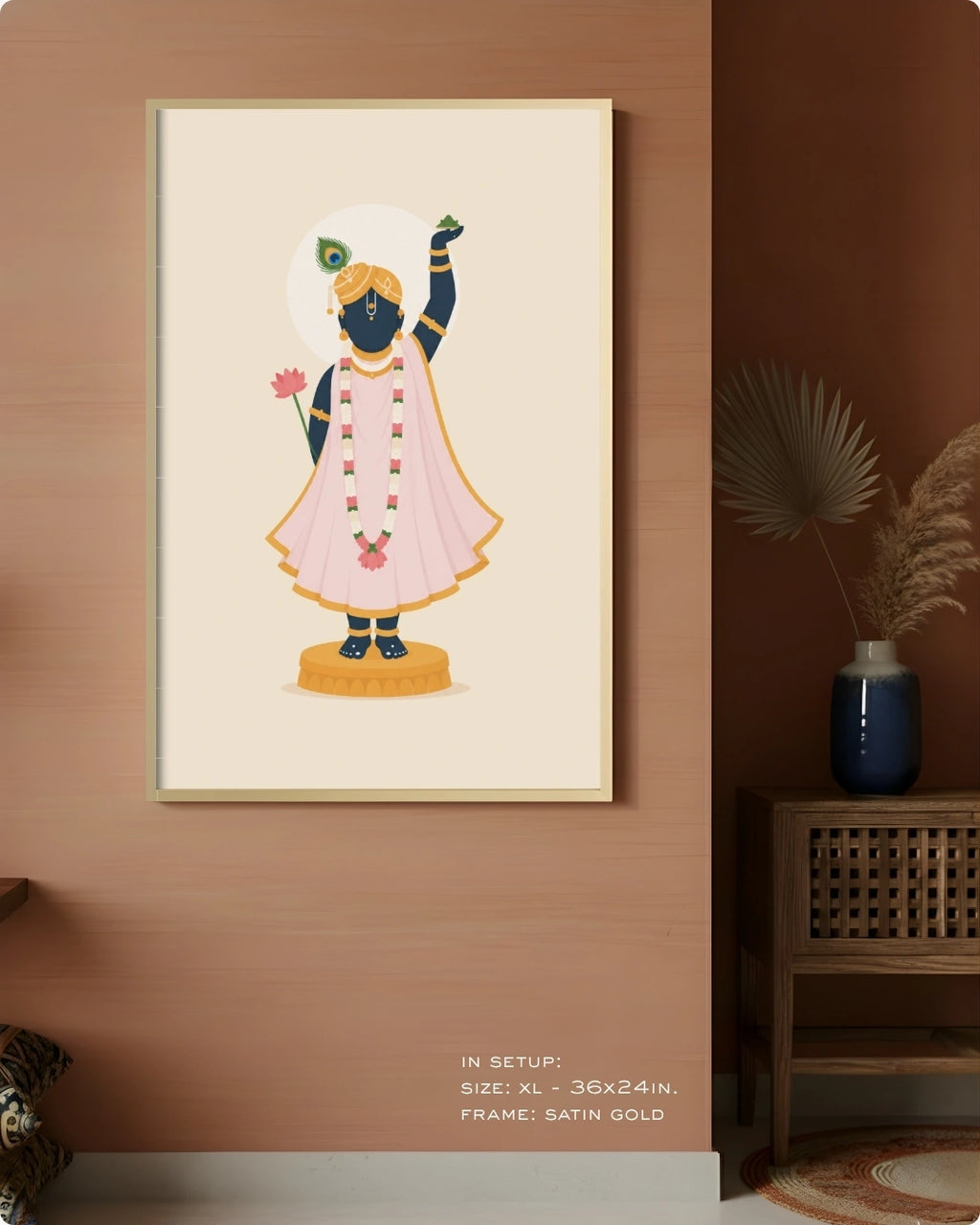 A framed art print depicting a stylized illustration of Lord Shrinathji hanging on a warm terracotta-colored wall in a styled room setting.