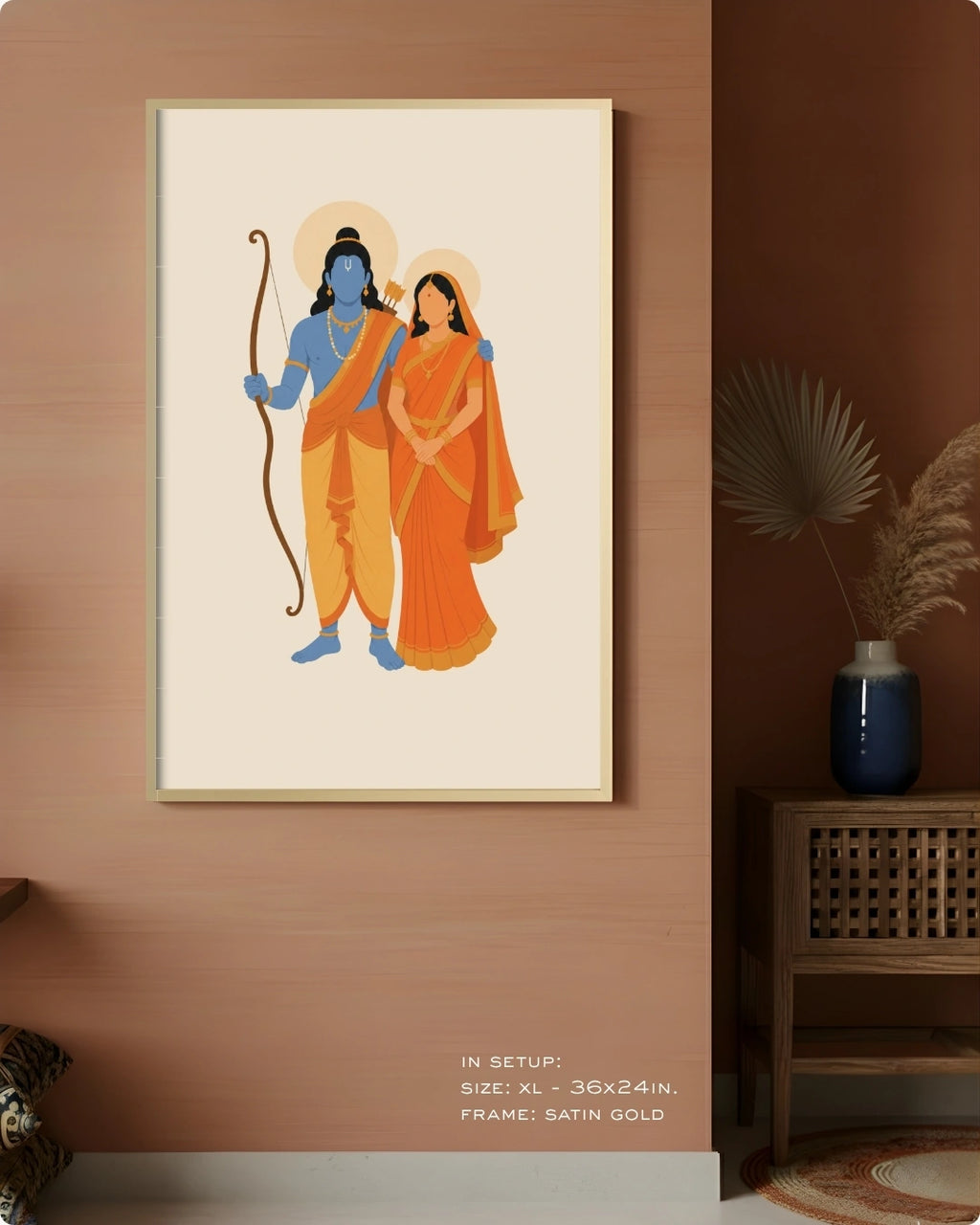 Visual size guide mockup for the Hindu divine couple Sita and Rama wall art in Extra Large size with a satin gold frame, displayed against a warm terracotta accent wall.