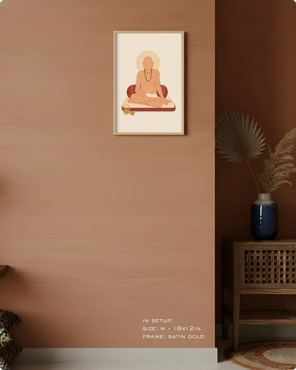 A framed art print featuring a minimalist illustration of Swami Samarth in a meditative pose, displayed on a warm terracotta wall in a styled interior setting with a wooden side table and a blue vase.