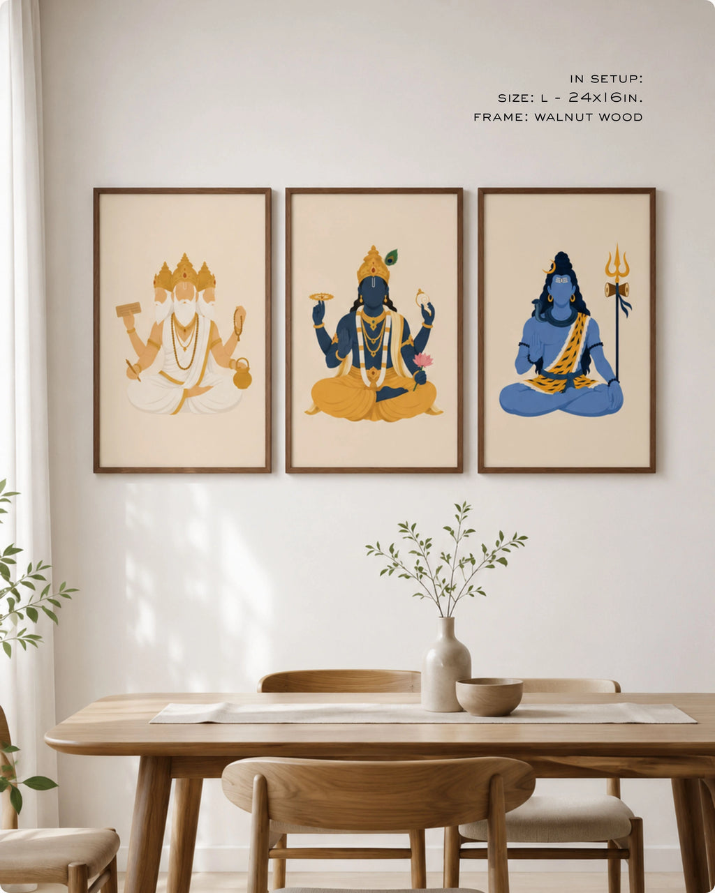 Lifestyle interior mockup of the Hindu Trimurti wall art set of 3, featuring Brahma, Vishnu, and Shiva in size Large (24x16 inches) with walnut wood frames, hung above a minimalist wooden dining room table.