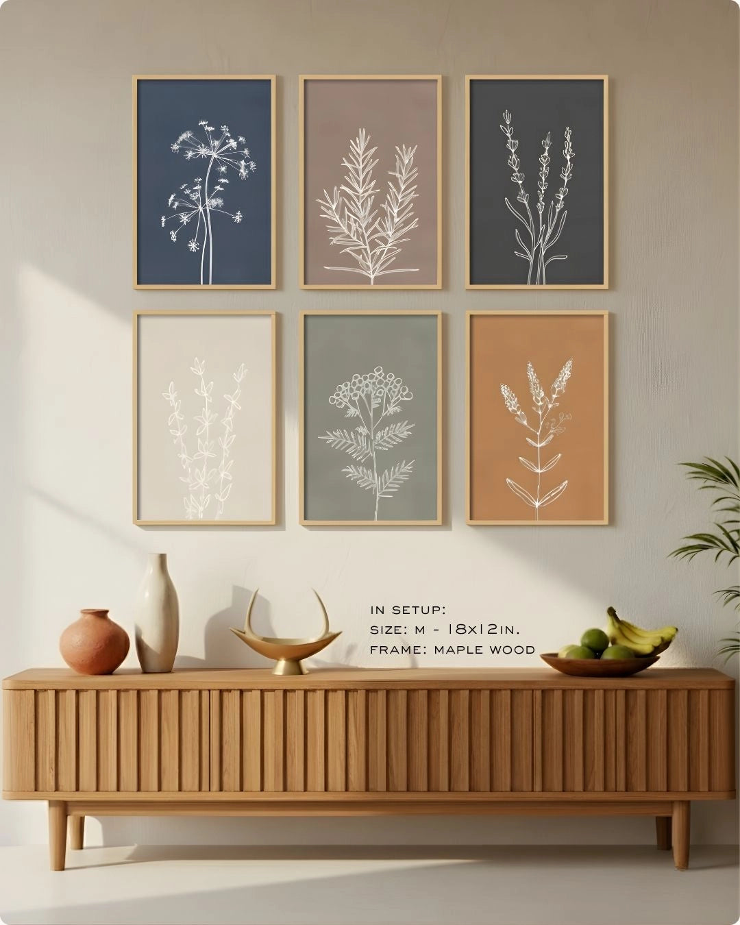 Medium (Size M - 18x12in) 6-piece botanical line art set in Maple Wood frames by K2C Co., featured in a minimalist living room mockup to demonstrate relative wall scale.