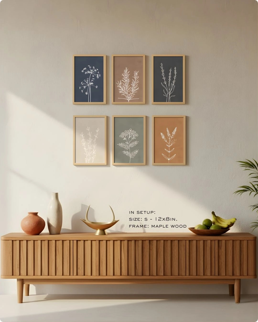 Small (Size S - 12x8in) 6-piece botanical line art set in Maple Wood frames by K2C Co., showing a compact gallery wall arrangement above a minimalist slatted sideboard.