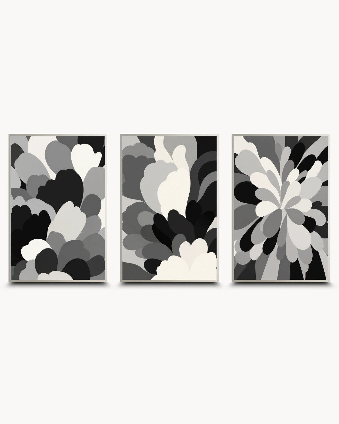 Three framed abstract wall art prints in a black, white, and gray color scheme, arranged side-by-side against a light gray background.
