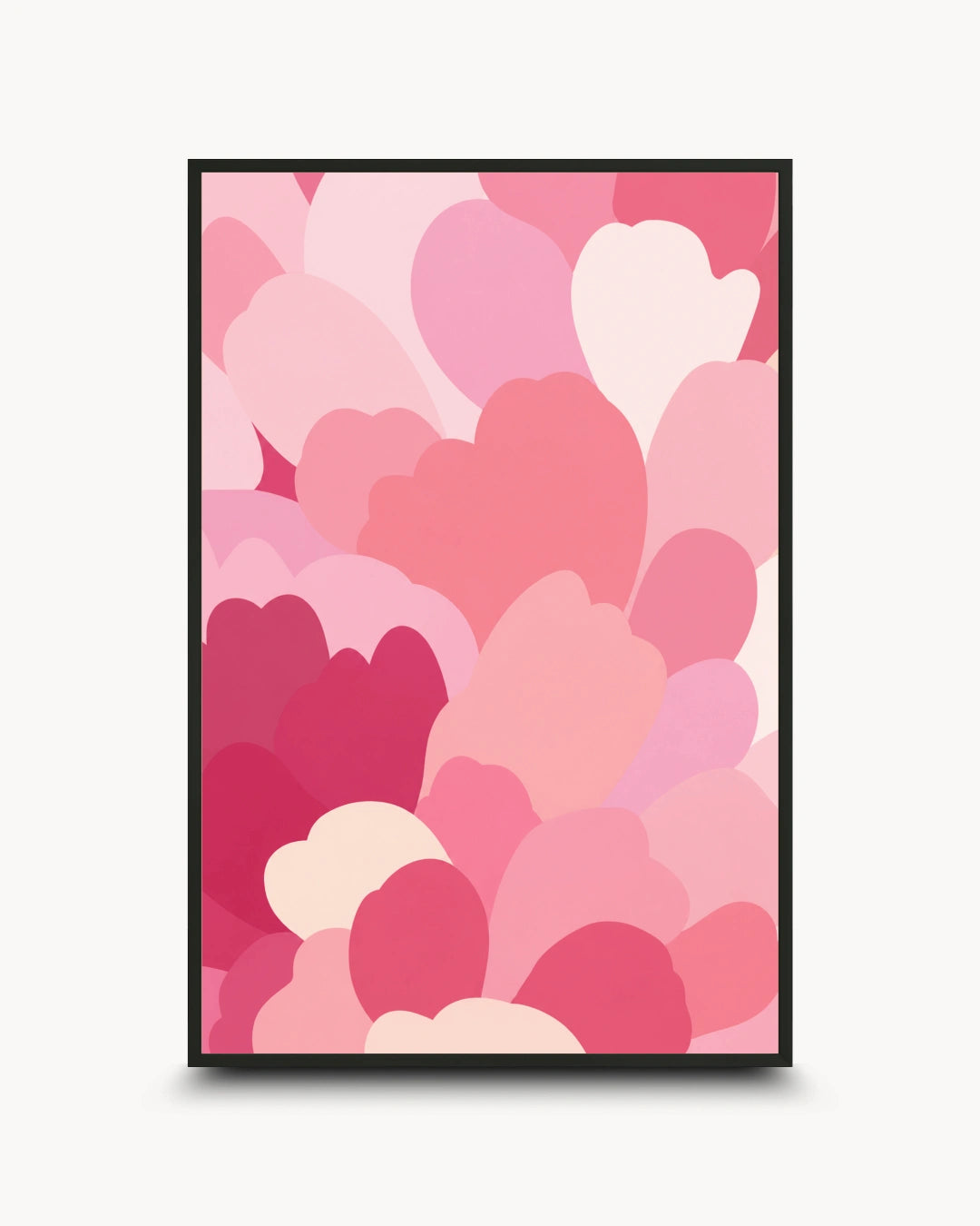 A framed art print featuring a modern pattern of overlapping hearts in various shades of pink, magenta, and light cream, set against a clean off-white background.