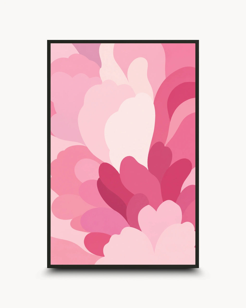 A framed abstract art print featuring layered, organic pink shapes in various shades of light, medium, and deep pink, enclosed in a thin black frame against a light gray background.