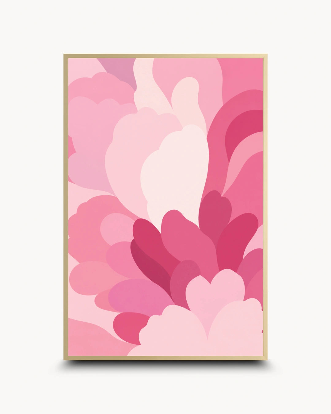 A framed abstract art print featuring layered, overlapping heart-like shapes in various shades of pink, from pale blush to deep magenta, set in a thin gold frame against a light off-white background.