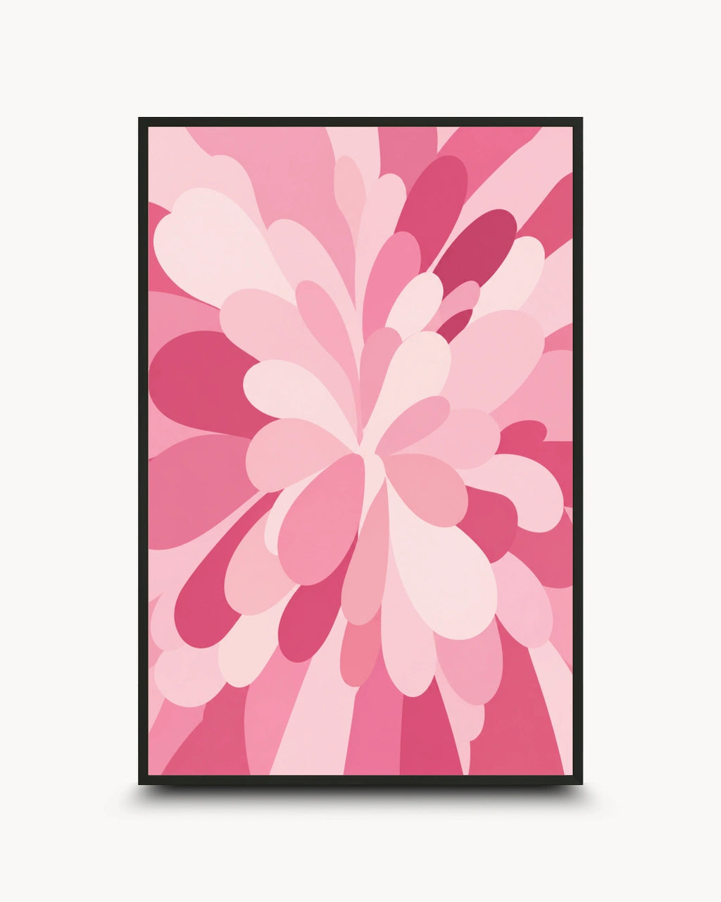 A framed abstract floral art print featuring layered pink and magenta petal-like shapes on a light background, shown against a plain light gray wall.