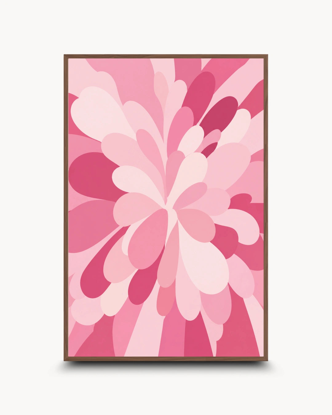 A framed abstract floral art print featuring layered pink and magenta petal-like shapes radiating from the center, shown against a light gray background.