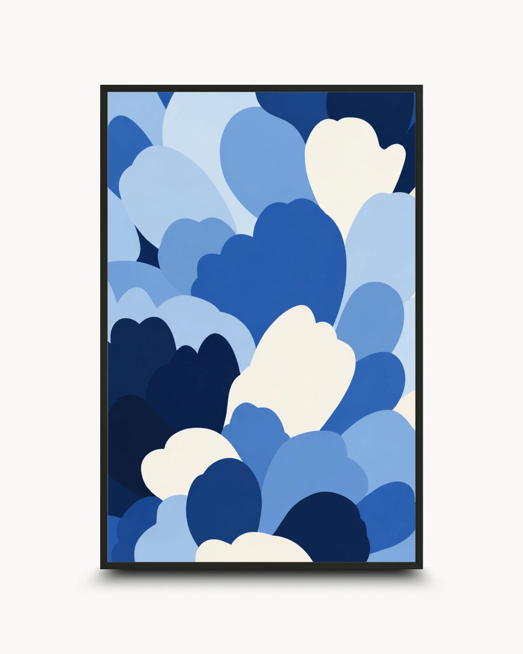 A framed abstract art print featuring overlapping cloud-like shapes in various shades of blue and white, set against a light gray background.