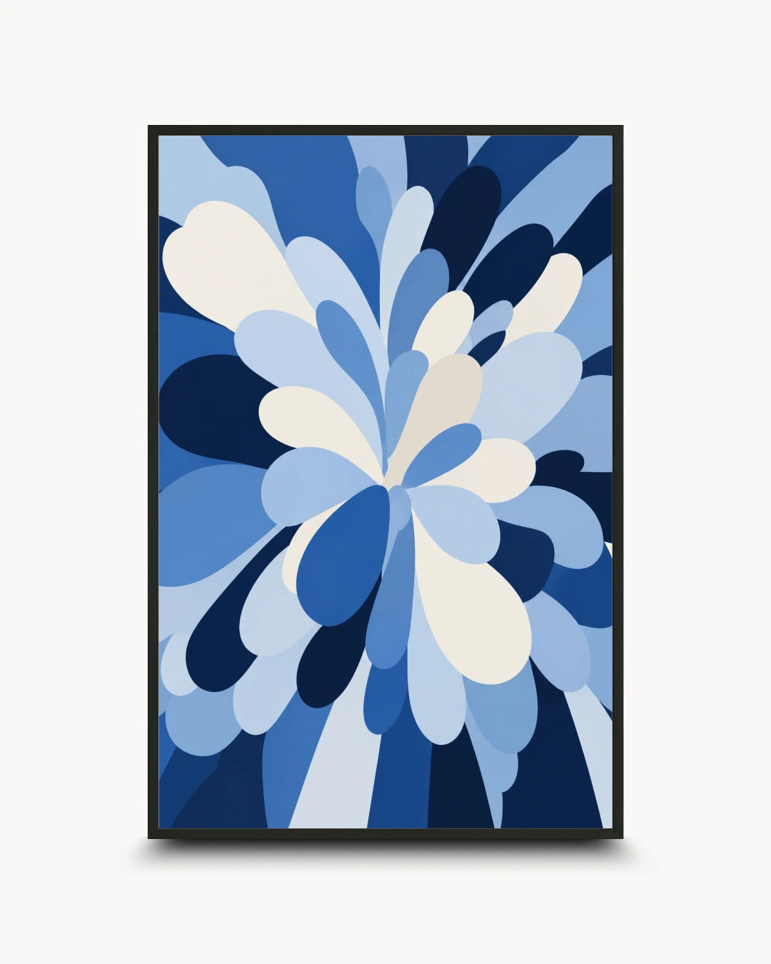 A framed abstract art print featuring a stylized floral burst in shades of blue, navy, light blue, and cream, set against a clean off-white background.