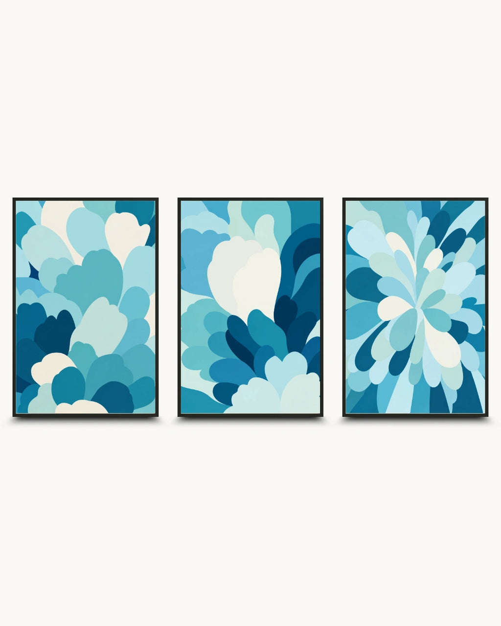 Three framed abstract wall art prints with layered petal-like shapes in shades of blue, teal, and white, displayed side by side against a light gray background.