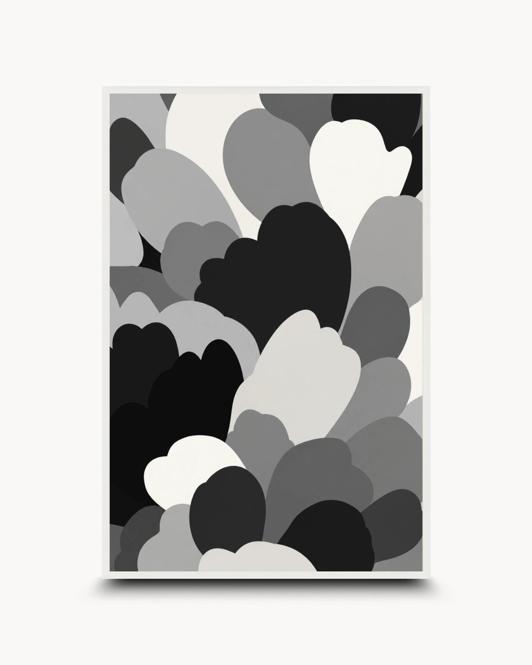 A framed abstract art print featuring overlapping heart and cloud-like shapes in black, gray, and white, displayed against a light gray background.