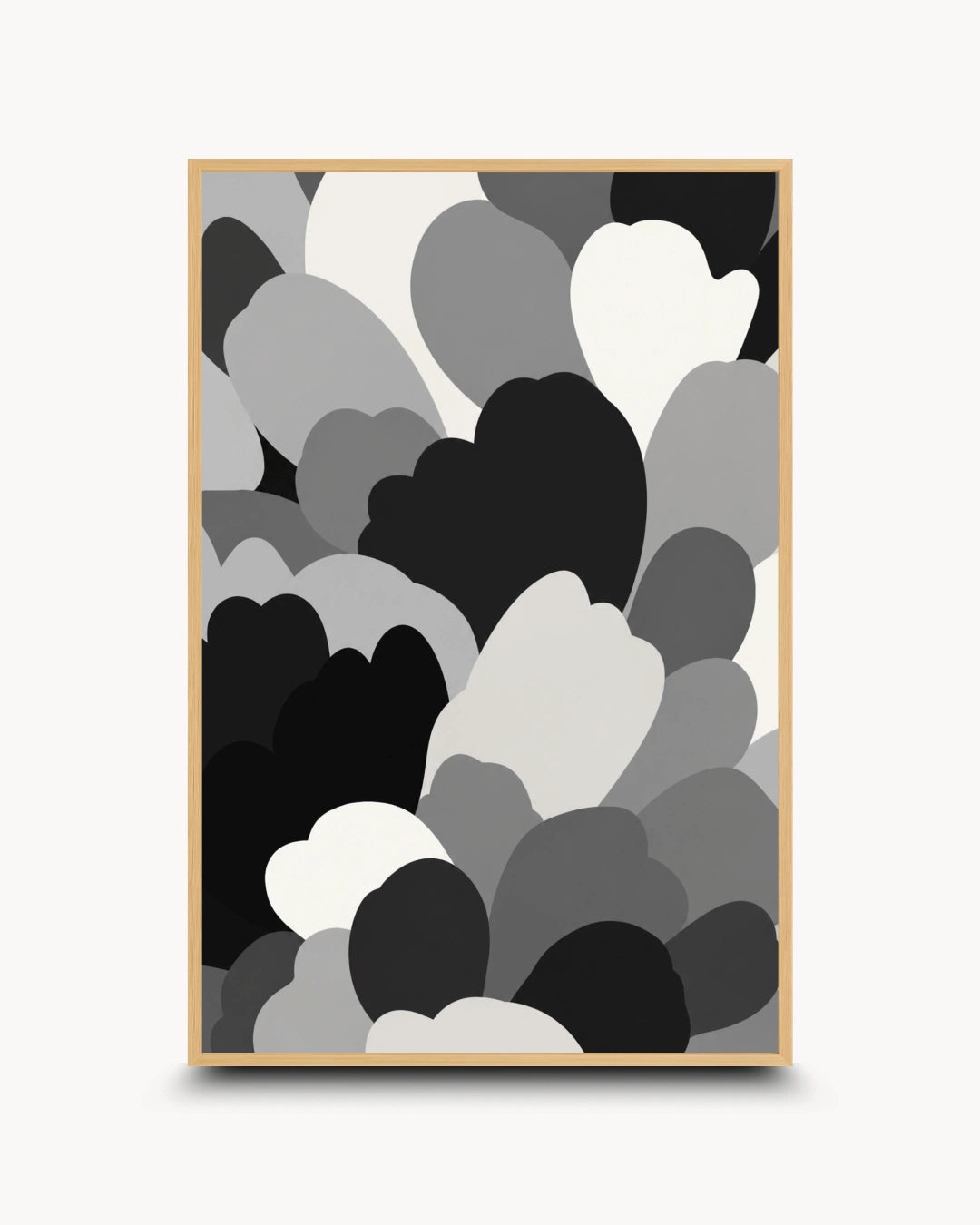 A framed abstract art print featuring overlapping heart and cloud-like shapes in black, gray, and white, displayed against a light gray background.