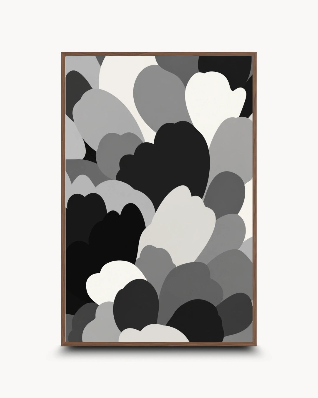 A framed abstract art print featuring overlapping heart and cloud-like shapes in black, gray, and white, displayed against a light gray background.