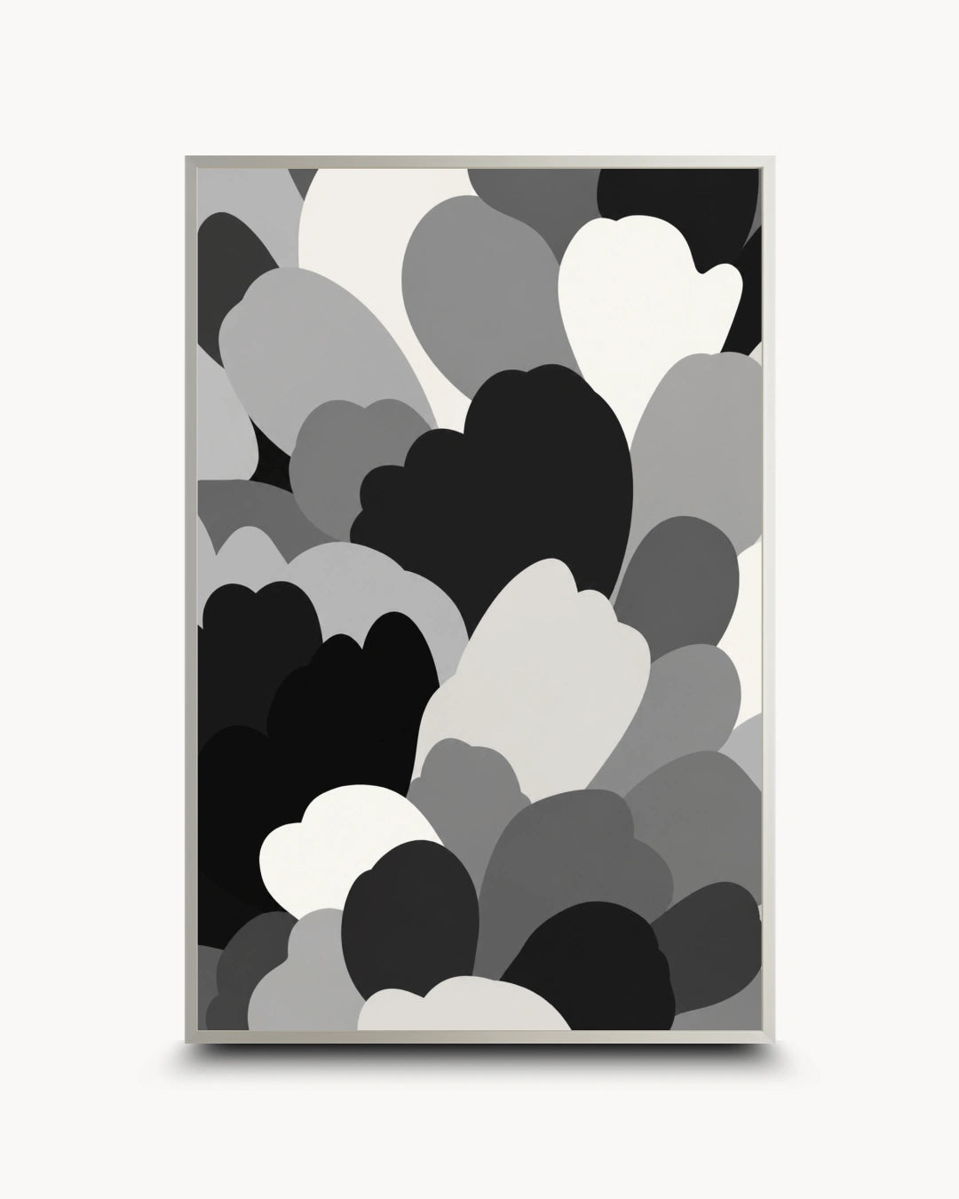 A framed abstract art print featuring overlapping heart and cloud-like shapes in black, gray, and white, displayed against a light gray background.