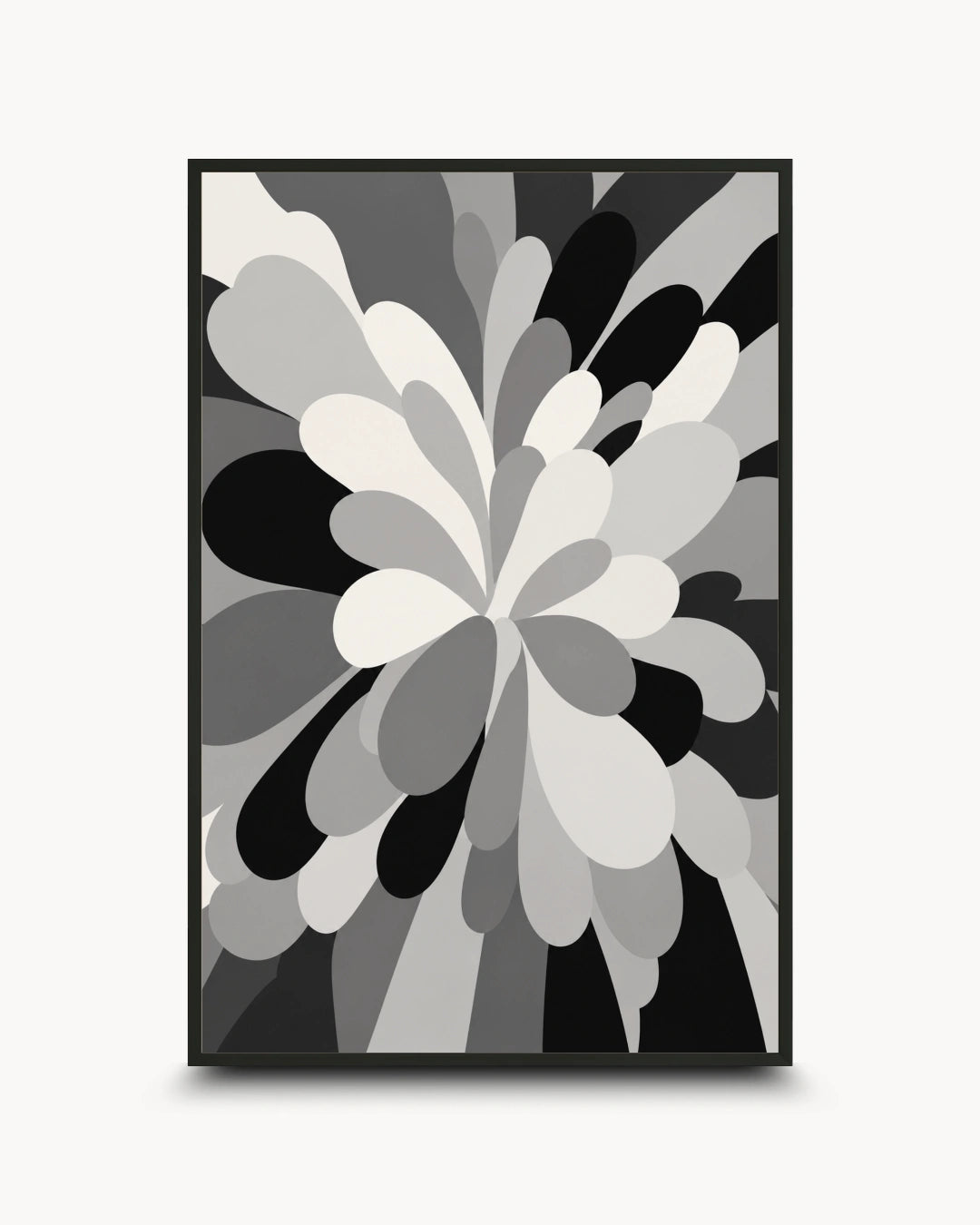 A framed abstract floral art print featuring layered petal-like shapes in black, gray, and white, presented on a light gray background.