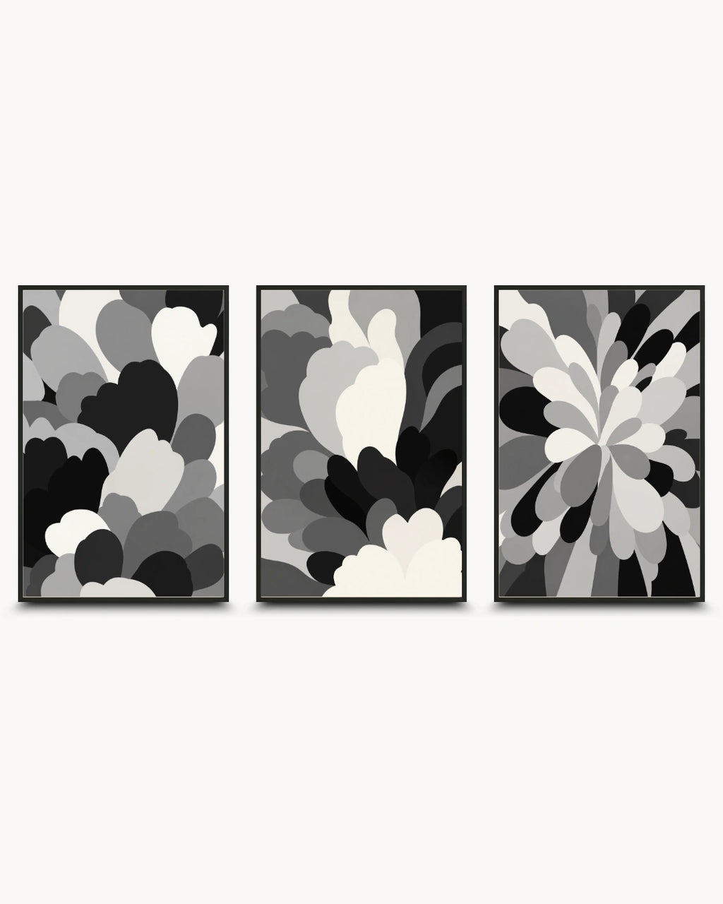 Three framed abstract wall art prints in a black, white, and gray color scheme, arranged side-by-side against a light gray background.