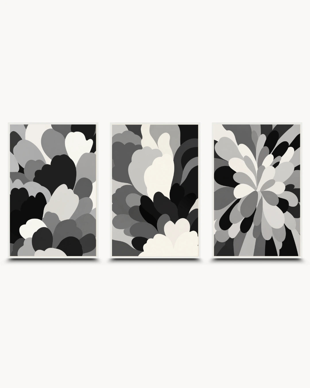 Three framed abstract wall art prints in a black, white, and gray color scheme, arranged side-by-side against a light gray background.