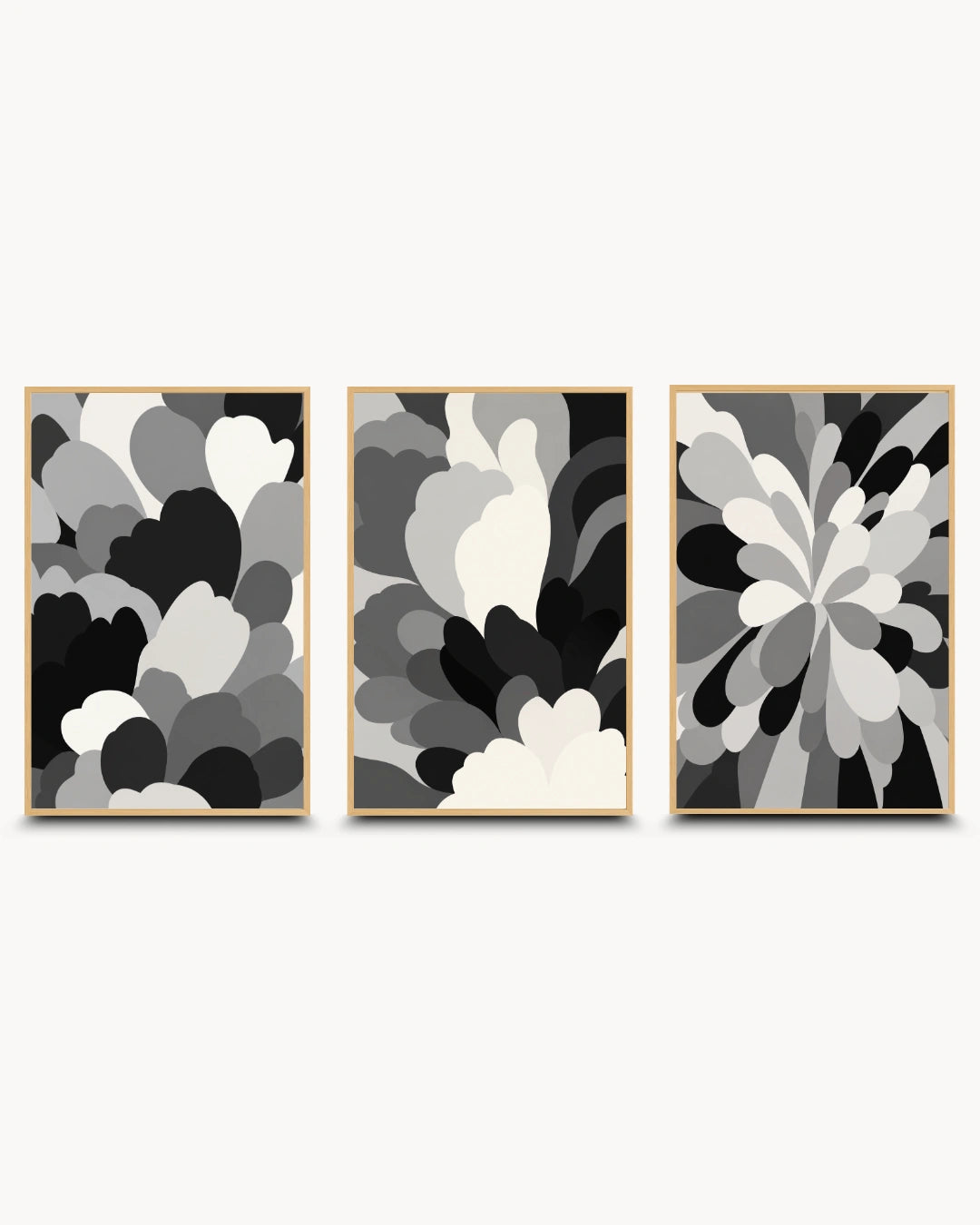 Three framed abstract wall art prints in a black, white, and gray color scheme, arranged side-by-side against a light gray background.