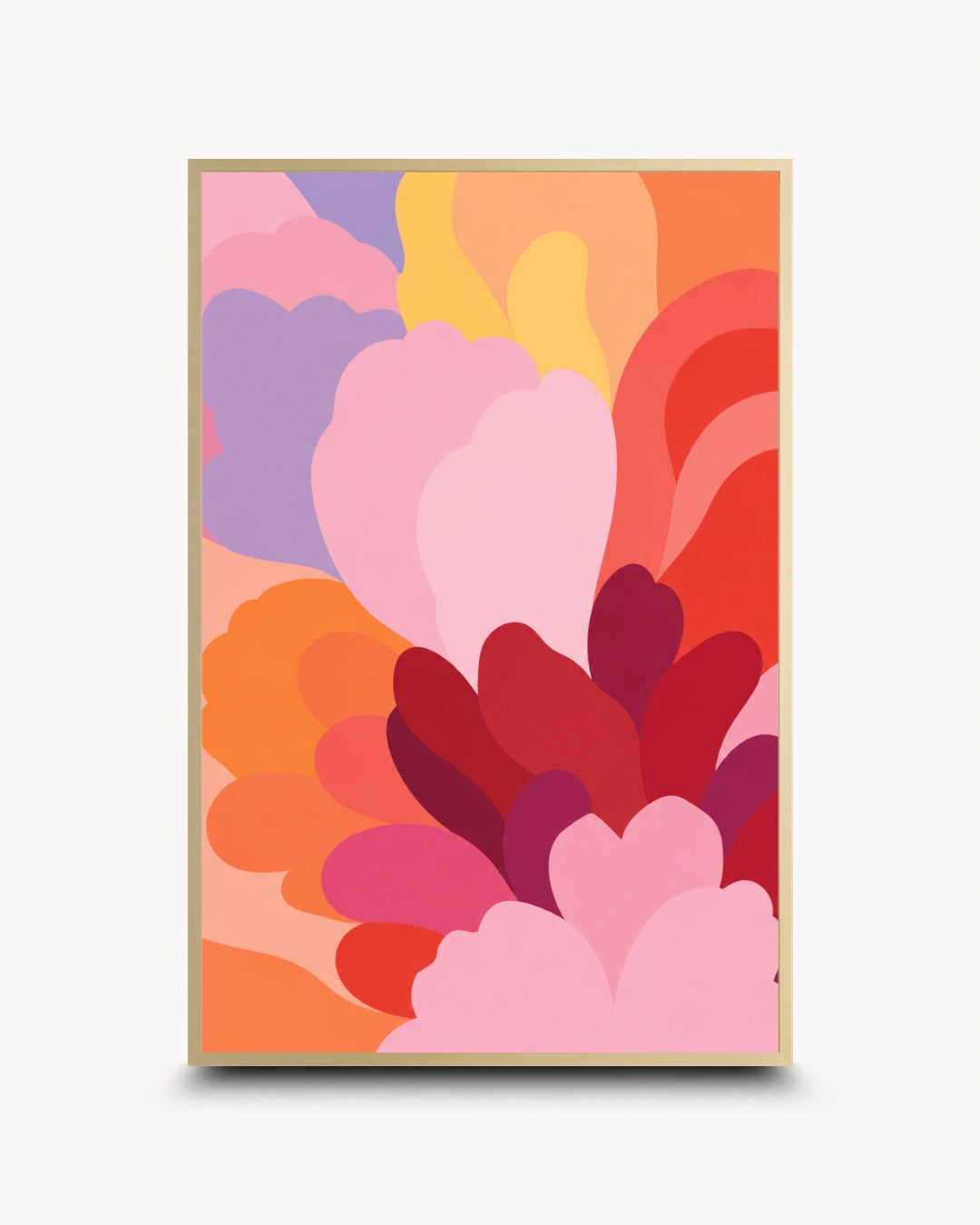 A framed abstract art print featuring layered, organic petal-like shapes in pink, red, orange, yellow, and purple, displayed against a clean off-white background.