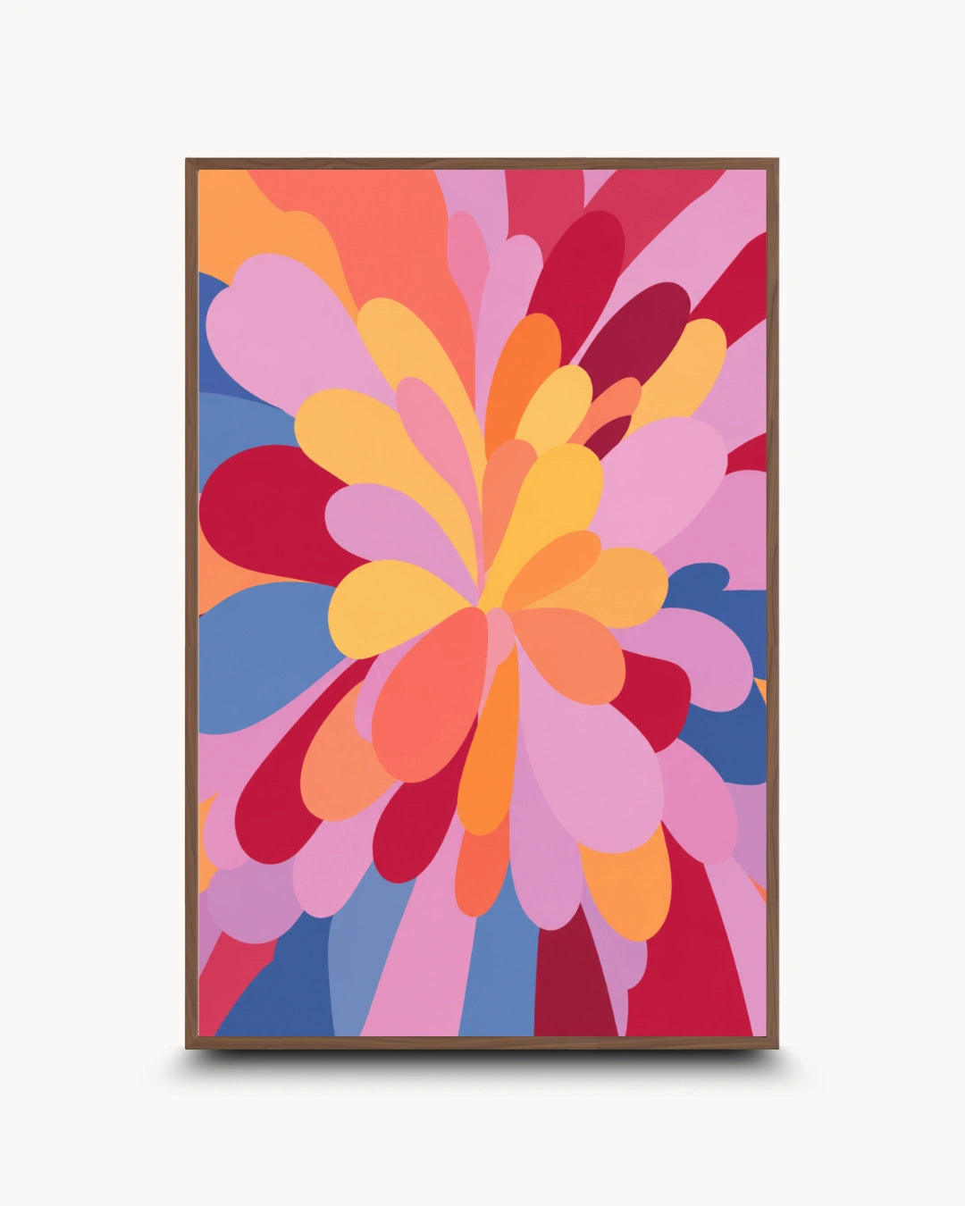 A framed abstract floral art print featuring a retro 1970s design with layered petal shapes in pink, orange, yellow, red, and blue, set against a light gray background.