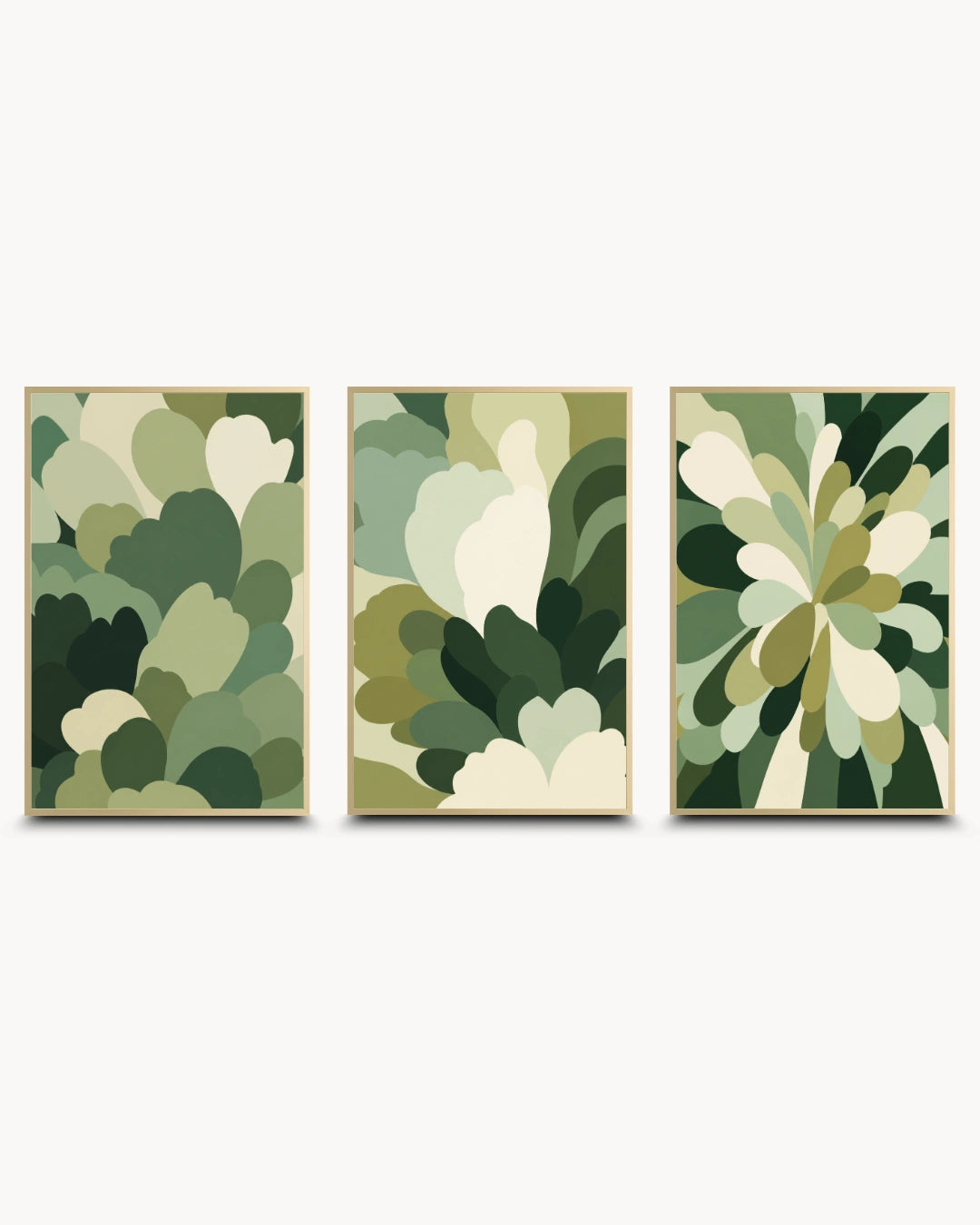 Three framed abstract botanical wall art prints in a triptych arrangement, featuring layered leaf-like shapes in shades of green, olive, beige, and cream on a light gray background.