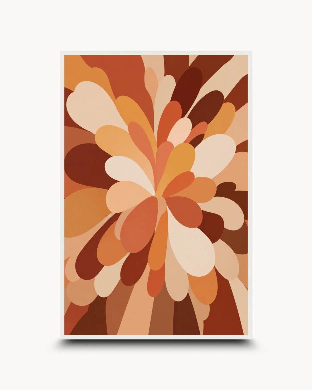 A framed abstract art print featuring a retro-style floral burst pattern in warm earth tones of brown, orange, beige, and cream, displayed against a light gray background.