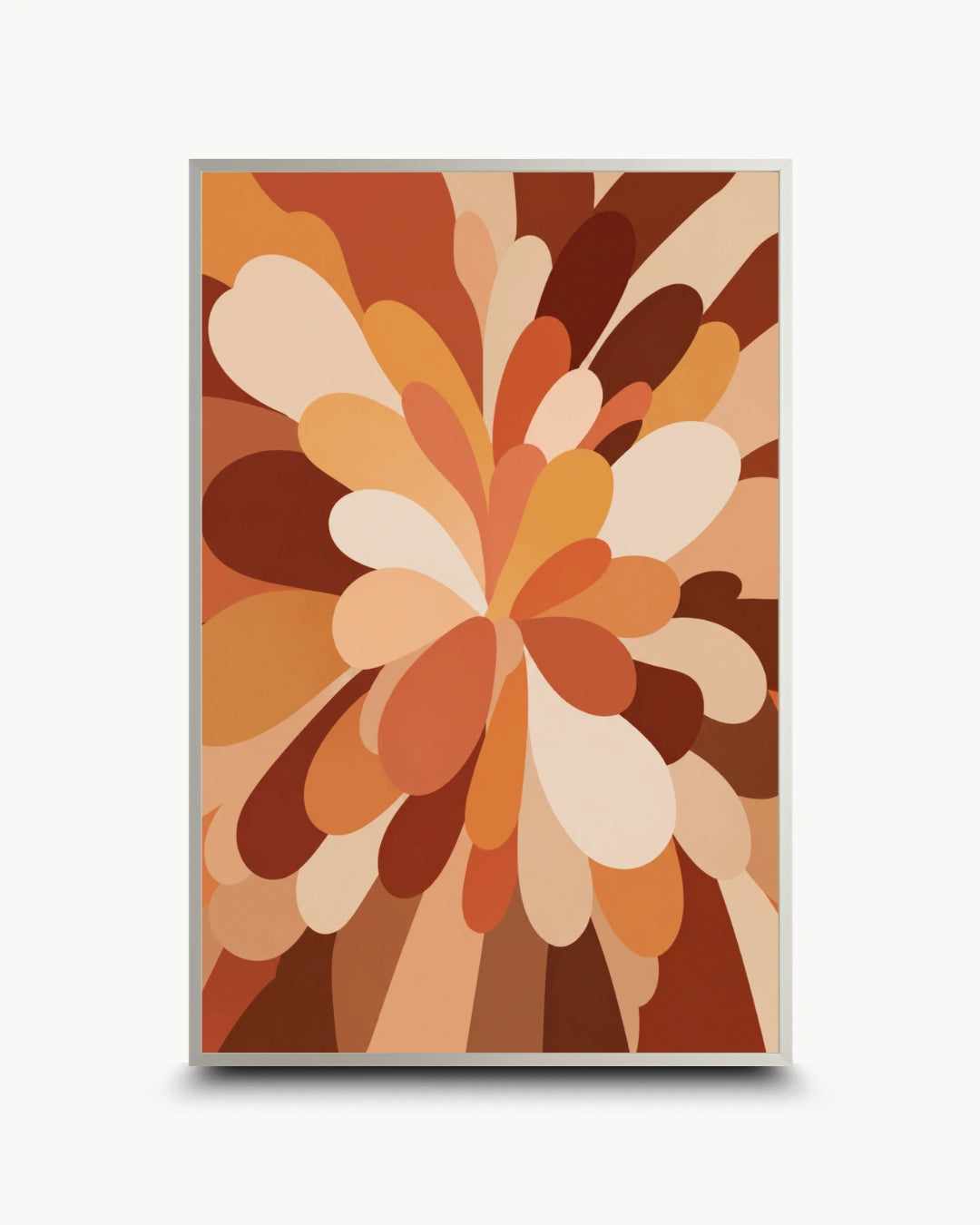 A framed abstract art print featuring a retro-style floral burst pattern in warm earth tones of brown, orange, beige, and cream, set against a light gray background.