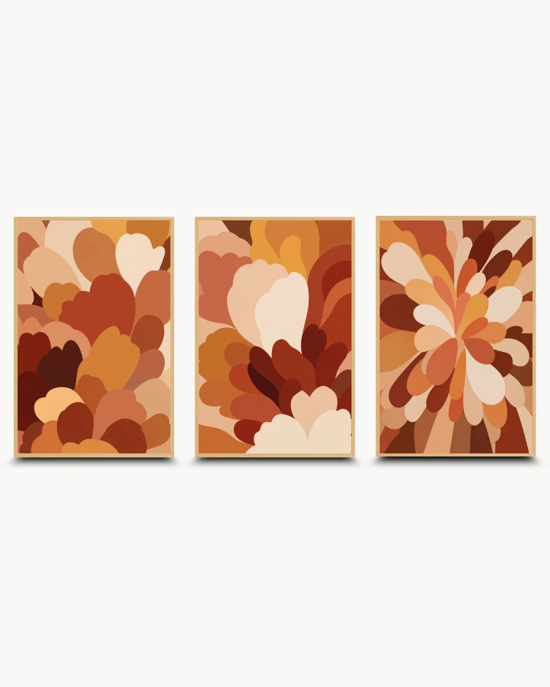A set of three framed abstract wall art prints in a warm autumn palette, arranged side by side against a light gray background.