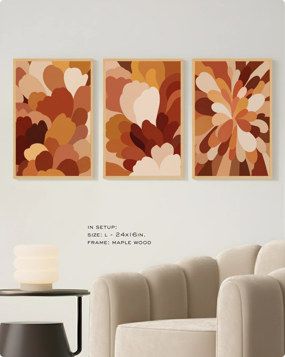 Three-piece abstract wall art set featuring organic floral shapes in warm earthy tones, displayed on a light gray wall above a beige armchair and side table. Text indicates setup details: size 24x16 in, maple wood frame.