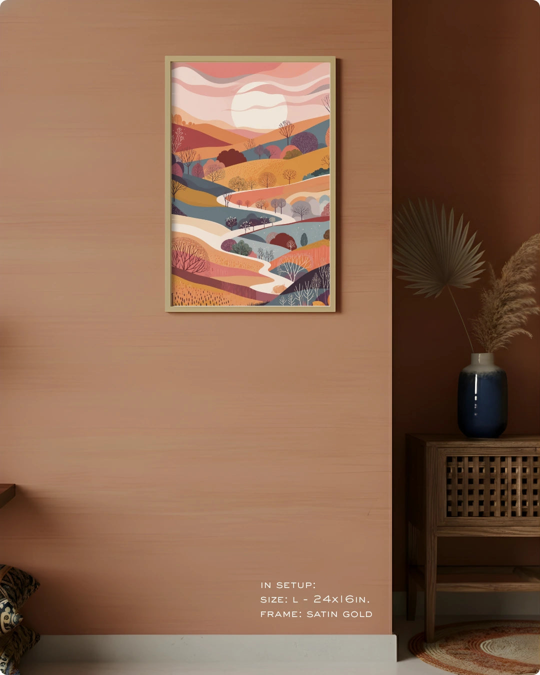 Visual size guide mockup for the Terra 1 landscape wall art in Large size with a Satin Gold frame displayed over a woven cabinet against a terracotta wall.