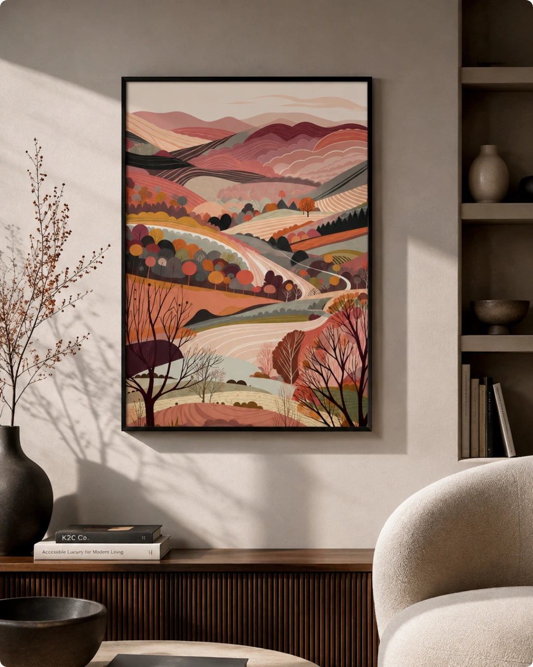 Lifestyle mockup of the Terra 3 landscape wall art in a Noir Black frame styled above a dark wood console beside a beige chair in a warm minimalist room.